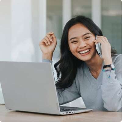 Women smiling phone laptop